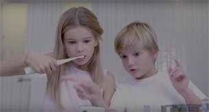 Two children using their smart electric toothbrushes